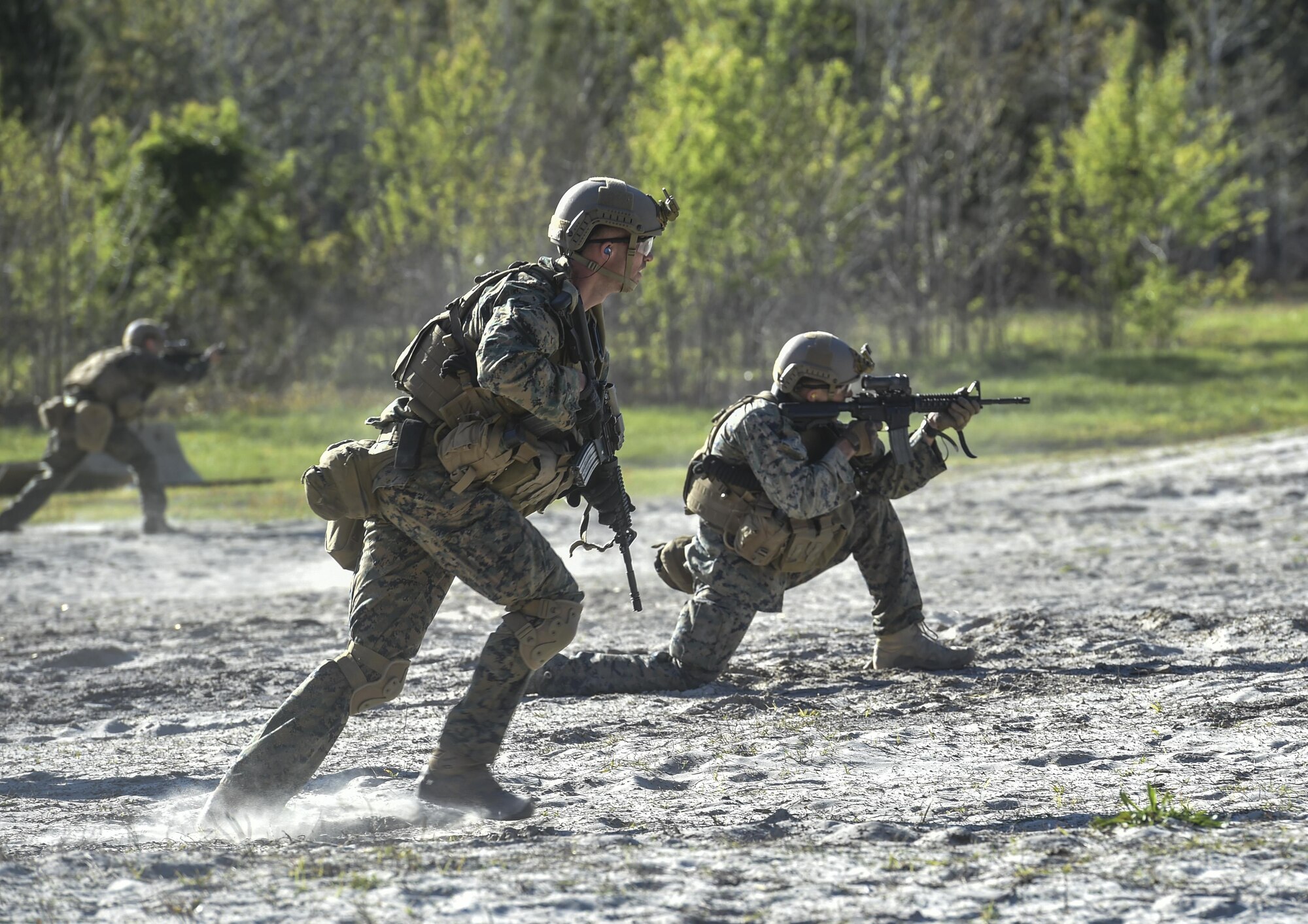 Marine Special Operations School Individual Training Course students run toward targets during live-fire maneuvering training, April 11, 2017, at Camp Lejeune, N.C. For the first time, U.S. Air Force Special Tactics Airmen spent three months in Marine Special Operations Command’s Marine Raider training pipeline, representing efforts to build joint mindsets across special operations forces.  (U.S. Air Force photo by Senior Airman Ryan Conroy)