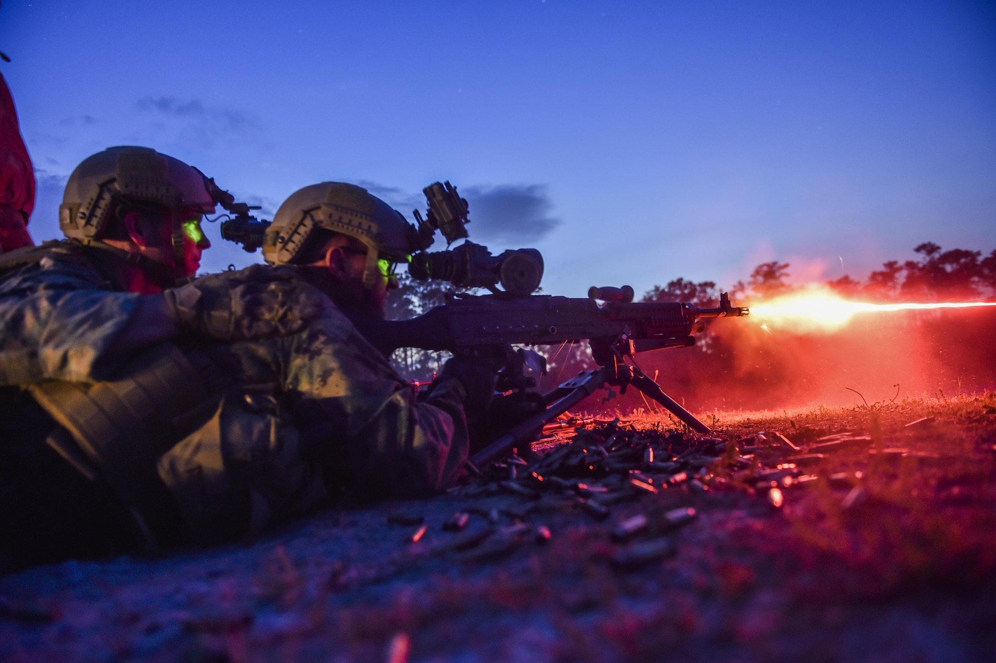 Marine Special Operations School Individual Training Course students fire an M249 squad automatic weapon during night-fire training April 13, 2017, at Camp Lejeune. For the first time, U.S. Air Force Special Tactics Airmen spent three months in Marine Special Operations Command’s Marine Raider training pipeline, representing efforts to build joint mindsets across special operations forces.  (U.S. Air Force photo by Senior Airman Ryan Conroy)