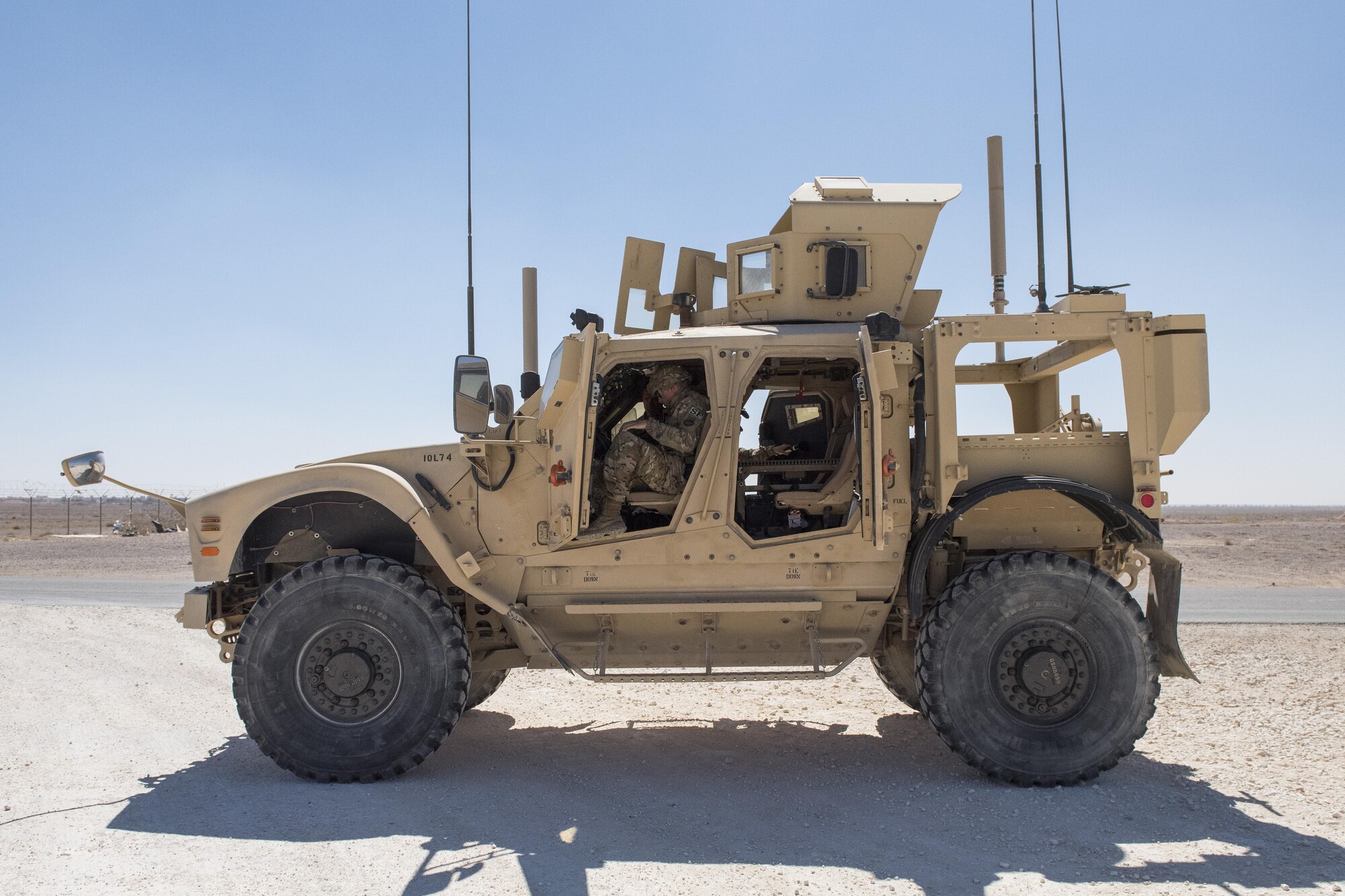 Airman Troy Mailloux, 332nd Expeditionary Security Forces Squadron fire team member, gets situated inside a mine-resistant ambush protected all-terrain vehicle May 26, 2017, in Southwest Asia. Security forces Airmen must complete training before operating an M-ATV in operational scenarios. (U.S. Air Force photo/Senior Airman Damon Kasberg)