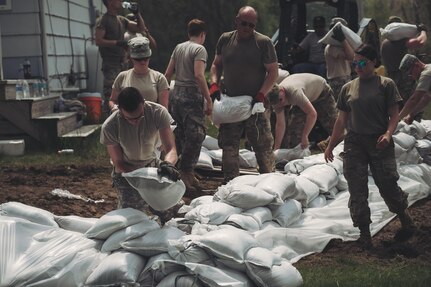 Soldiers of the New York Army National Guard set up barriers of sandbags around homes along the Lake Ontario shoreline May 18, 2017, after rising water levels have resulted in flooding and a state of emergency being declared on May 2 by Gov. Andrew Cuomo, Kendall, N.Y.