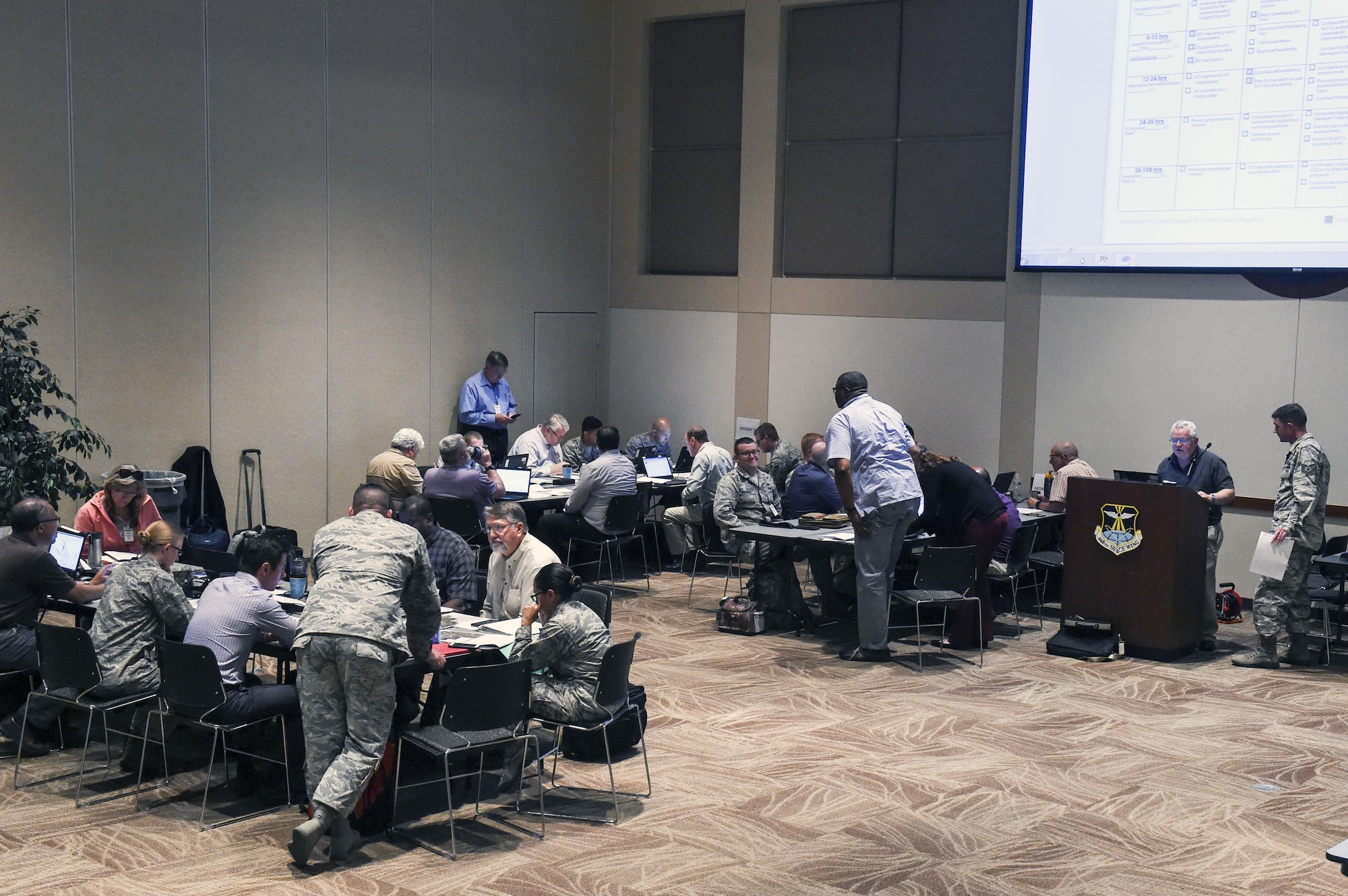 Team Buckley members from all base partners engage in preperations during the Chemical Weapons Convention Treaty training exercise June 6-8, 2017, at Buckley Air Force Base, Colo. The team provided base support in order to complete the exercise in the most realistic way possible. (U.S. Air Force photo by Tech. Sgt. Nicholas Rau)