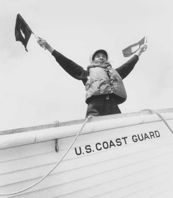 Station Pea Island, North Carolina
USLSS Station #17, Sixth District
 Coast Guard Station #177
Surfman Fleetwood M. Dunston, USCG  
Surfman Fleetwood M. Dunston of the Pea Island Coast Guard Station signals "Aid is Coming" during a training exercise.
No photo number/date; probably 1942.
