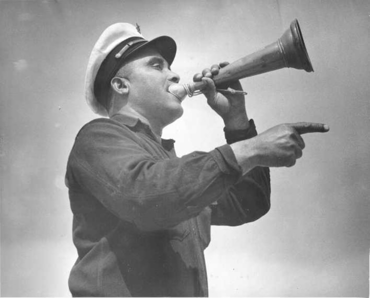 Station Pea Island, North Carolina
USLSS Station #17, Sixth District
 Coast Guard Station #177
Petty Officer First Class First Class Maxie Berry, Sr., USCG
BM 1/c Maxie Berry, Sr., USCG, the Officer in Charge of the historic Pea Island Station, uses a speaking trumpet during a training exercise at Pea Island Station in the early 1940's.
No photo number/date; probably 1942. 
