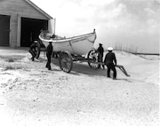 Station Pea Island, North Carolina
USLSS Station #17, Sixth District
Coast Guard Station #177
Coast Guard Lifeboat Station Pea Island Crew  
Official caption reads: "Coast Guard crew making ready their surfboat at the all-Negro Coast Guard Lifeboat Station at Pea Island, N.C."
No date/photo number; photographer unknown.  Probably 1942.






