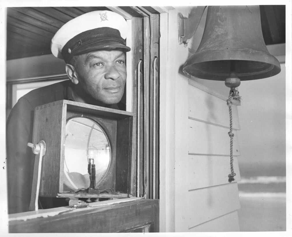 Station Pea Island, North Carolina
USLSS Station #17, Sixth District
Coast Guard Station #177
Petty Officer First Class Lonnie C. Gray, USCG   
Original caption reads: "Blinking signals from the Lookout Tower at Pea Island identify friendly craft.  Lonnie C. Gray, B.M. 1c is shown on the alert."  
No photo number/date; probably 1942. 







