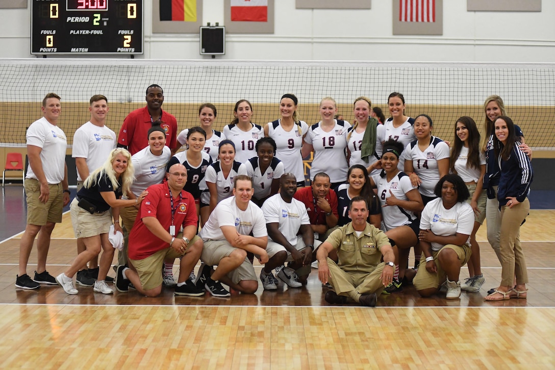 Naval Station Mayport Base Commander Navy Captain David Yoder joins the U.S. squad after USA defeated Germany in Match 6 of the 18th Conseil International du Sport Militaire (CISM) World Women's Military Volleyball Championship on 6 June 2017 at Naval Station Mayport, Florida. (Photo by Petty Officer 2nd Class Timothy Schumaker, NPASE East).