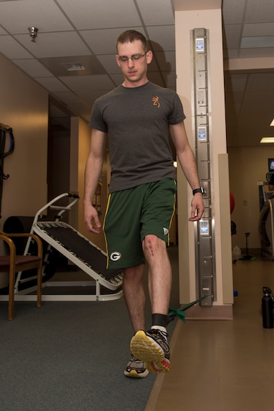 Michael Chitwood, physical therapy patient, performs leg exercises at the 27th Special Operations Medical Group Physical Medicine Office April 26, 2017, at Cannon Air Force Base, NM. The different color bands have different resistances and patients can utilize the bands to increase the strength of the muscles in their arms or legs. (U.S. Air Force photo by Staff Sgt. Michael Washburn/Released)