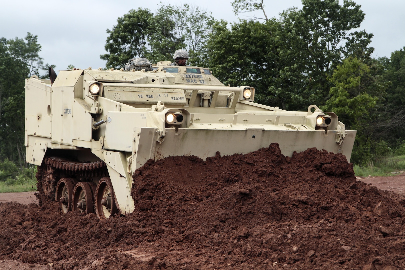 Sgt. Ricardo Lindsay, horizontal construction engineer with 252nd Quarter Master Company, 728th Combat Sustainment Support Battalion, 213th Regional Support Group, Pennsylvania Army National Guard, creates a level surface using an armored combat earthmover at Fort Indiantown Gap, Pa., June 6, 2017. Lindsay trained on this equipment for the first time in preparation for his role within the unit.