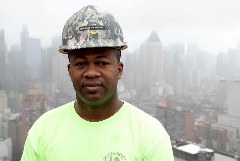 U.S. Army Reserve Soldier Akini Celestine from 455th Engineer Detachment poses for a photo on top of the building he works at in New York City, N.Y. May 22, 2017. Celestine serves as a horizontal construction engineer as a sergeant in the Army Reserves’ 455th Engineer Detachment in Farmington, N.Y. During the month he works construction in the city as a Journeyman Plumber Apprentice. (U.S. Army Photo by Sgt. Jose A. Torres Jr.)