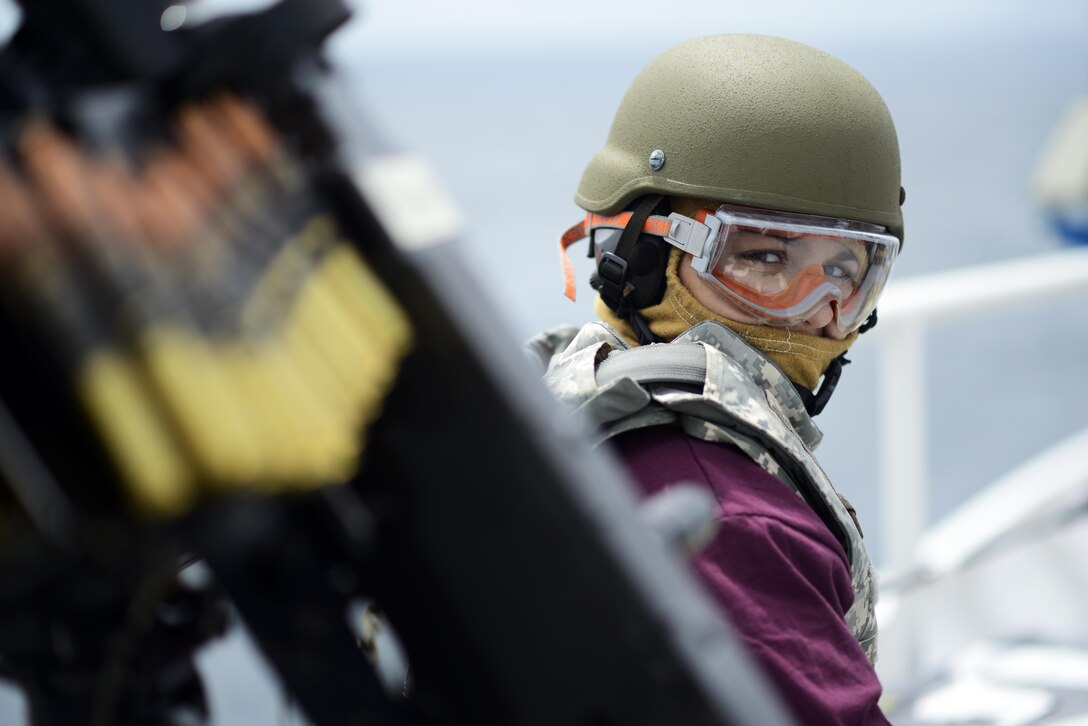 Seaman Mia Mauro, stationed on the Coast Guard Cutter Winslow Griesser, prepares to shoot the .50 cal machine gun during a joint gunnery exercise between allied and partner nations in the Caribbean Sea, June  8, 2017 during Tradewinds. Tradewinds 2017 is a joint combined exercise conducted in conjunction with partner nations to enhance the collective abilities of defense forces and constabularies to counter transnational organized crime and to conduct humanitarian/disaster relief operations. U.S. Coast Guard photo by Petty Officer 2nd Class Adam Stanton