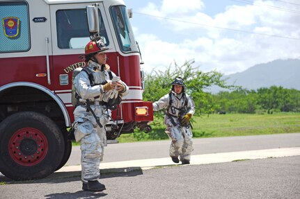 U.S. Air Force Staff Sergeant Zachary White (left), 612th Air Base Squadron, participates in a simulated call to action exercise in response to a fire emergency at Soto Cano Air Base, May 25th, 2017. Staff Sgt. White works as a fire crew chief at Joint Task Force-Bravo’s Fire Department and has a team of four working under him. Striving to maintain readiness among his team, he teaches them the proper procedures to prepare and respond to an emergency situation.   (U.S. Army photo by Maria Pinel)