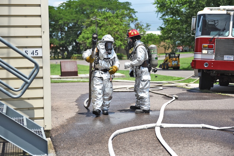 U.S. Air Force Staff Sergeant Zachary White (right), 612th Air Base Squadron, provides guidance for a fellow Airman during a simulated call to action exercise in response to a fire emergency at Soto Cano Air Base, May 25th, 2017. Striving to maintain readiness among his team, he constantly teaches them the proper procedures to prepare and respond to an emergency situation.  (U.S. Army photo by Maria Pinel)