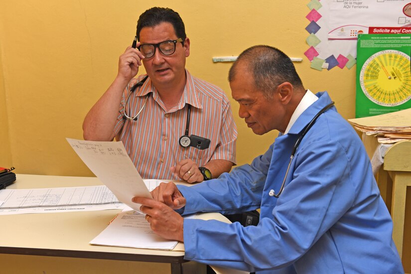 Dr. Carlos Duron (left) and Lt. Col. (Dr.) Jack Leong, Joint Task Force-Bravo Medical Element, review patient records at the Regional Health Center in the Tepanguare village located in La Paz, Honduras, May 24, 2017. The doctors participated in a monthly visit to the clinic where they provide free consultations and medications to the local population from Tepanguare and neighboring communities. 