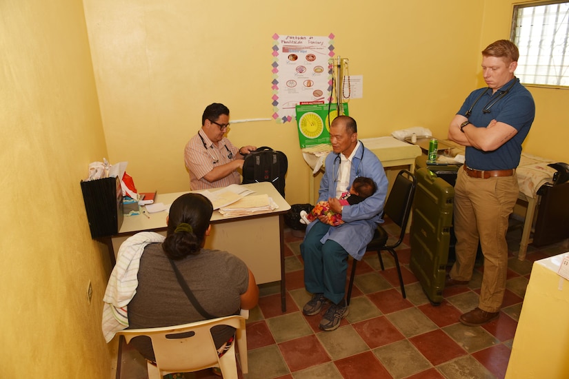 Dr. Carlos Duron (left), U.S. Army Lt. Col. (Dr.) Jack Leong (center) and U.S. Army Spc. Timothy Morrison, Joint Task Force-Bravo Medical Element, receive patients at the Regional Health Center in the Tepanguare village located in La Paz, Honduras, May 24, 2017. The MEDEL staff participated in a monthly visit to the clinic where they provide free consultations and medications to the local population from Tepanguare and neighboring communities.