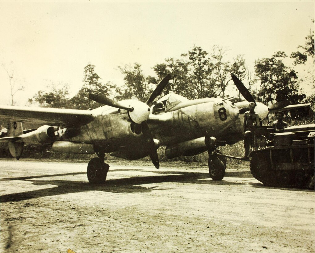 Airmen tow a P-38 Lightning assigned to the 8th Fighter Group, 35th Fighter Squadron, somewhere in the South Pacific during World War II. Courtesy photo