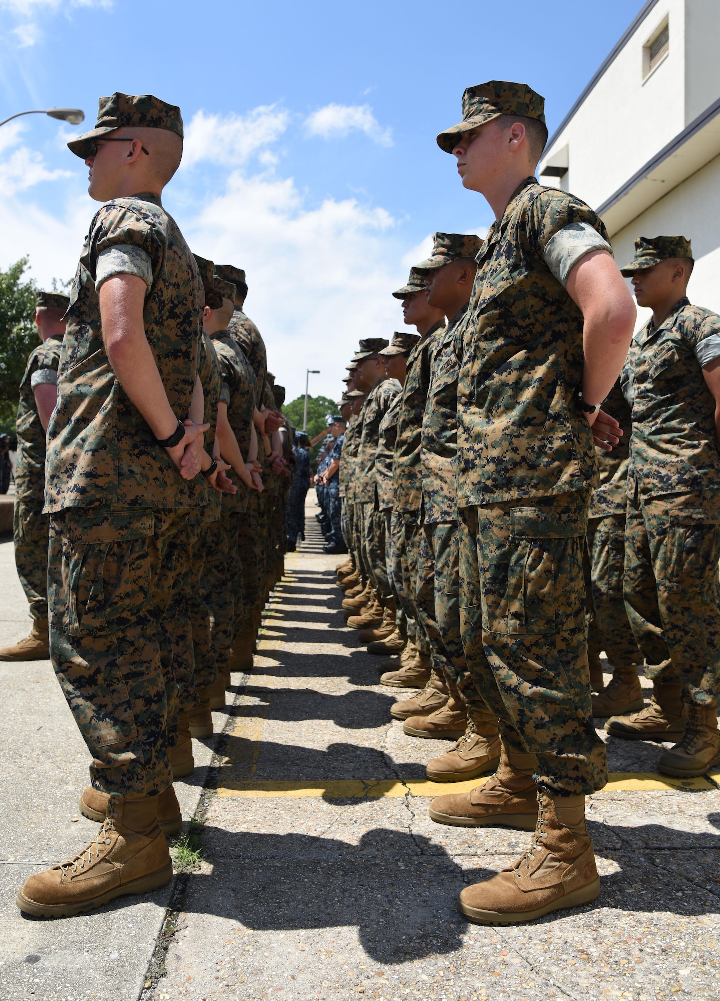 Keesler Marine Detachment members stand in formation during the Battle of Midway Commemoration Ceremony hosted by the Center for Naval Aviation Technical Training Unit Keesler June 7, 2017, on Keesler Air Force Base, Miss. The ceremony commemorated the 75th anniversary of the Battle of Midway, which was a U.S. naval victory during World War II. (U.S. Air force photo by Kemberly Groue)