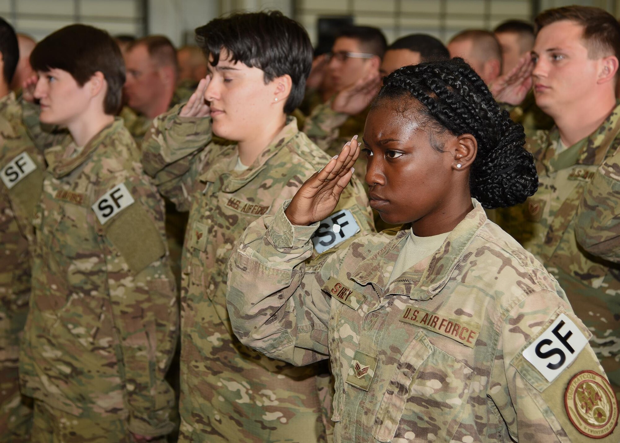 Defenders in the 90th Security Forces Group render a final salute to Col. Christopher Corley, their outgoing commander, at the 90th SFG Change of Command in the Peacekeeper High Bay on F.E. Warren Air Force Base, Wyo., June 9, 2017. Corley assumed command of the group during the ceremony which represents a formal transition of authority from the outgoing commanding to the incoming commander. (U.S. Air Force photo by Glenn S. Robertson)