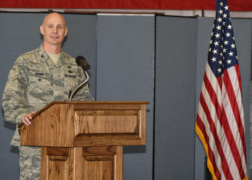 Colonel John Grimm, 90th Security Forces Group commander, speaks to the crowd attending the 90th SFG Change of Command June 9, 2017, in the Peacekeeper High Bay on F.E. Warren Air Force Base, Wyo. Grimm assumed command of the largest security forces group in the U.S. Air Force. (U.S. Air Force photo by Glenn S. Robertson)
