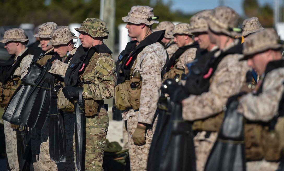 U.S. Marines and Airmen line up for a fin inspection during the Marine Special Operations School’s Individual Training Course, March 20, 2017 at Key West, Fla. For the first time, U.S. Air Force Special Tactics Airmen spent three months in Marine Special Operations Command’s initial Marine Raider training pipeline, representing efforts to build joint mindsets across special operations forces.  (U.S. Air Force photo by Senior Airman Ryan Conroy)
