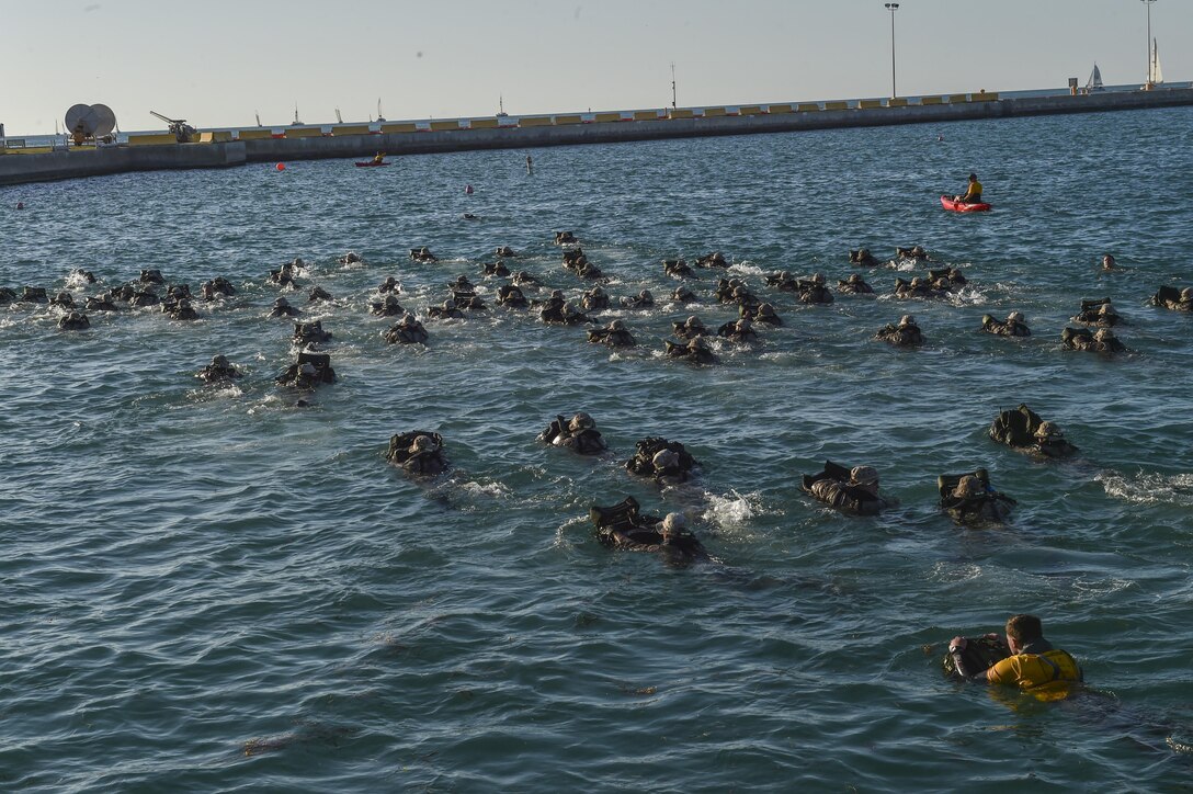 Marine Special Operations School Individual Training Course students perform a 2,000 meter swim, March 20, 2017, at Key West, Fla. For the first time, U.S. Air Force Special Tactics Airmen spent three months in Marine Special Operations Command’s initial Marine Raider training pipeline, representing efforts to build joint mindsets across special operations forces.  (U.S. Air Force photo by Senior Airman Ryan Conroy)