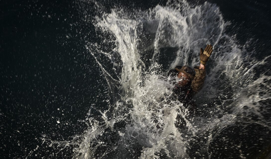 A U.S. Marine practices helocasting off a sea wall during Marine Special Operations School’s Individual Training Course, March 21, 2017, at Key West, Fla. For the first time, U.S. Air Force Special Tactics Airmen spent three months in Marine Special Operations Command’s initial Marine Raider training pipeline, representing efforts to build joint mindsets across special operations forces.  (U.S. Air Force photo by Senior Airman Ryan Conroy)