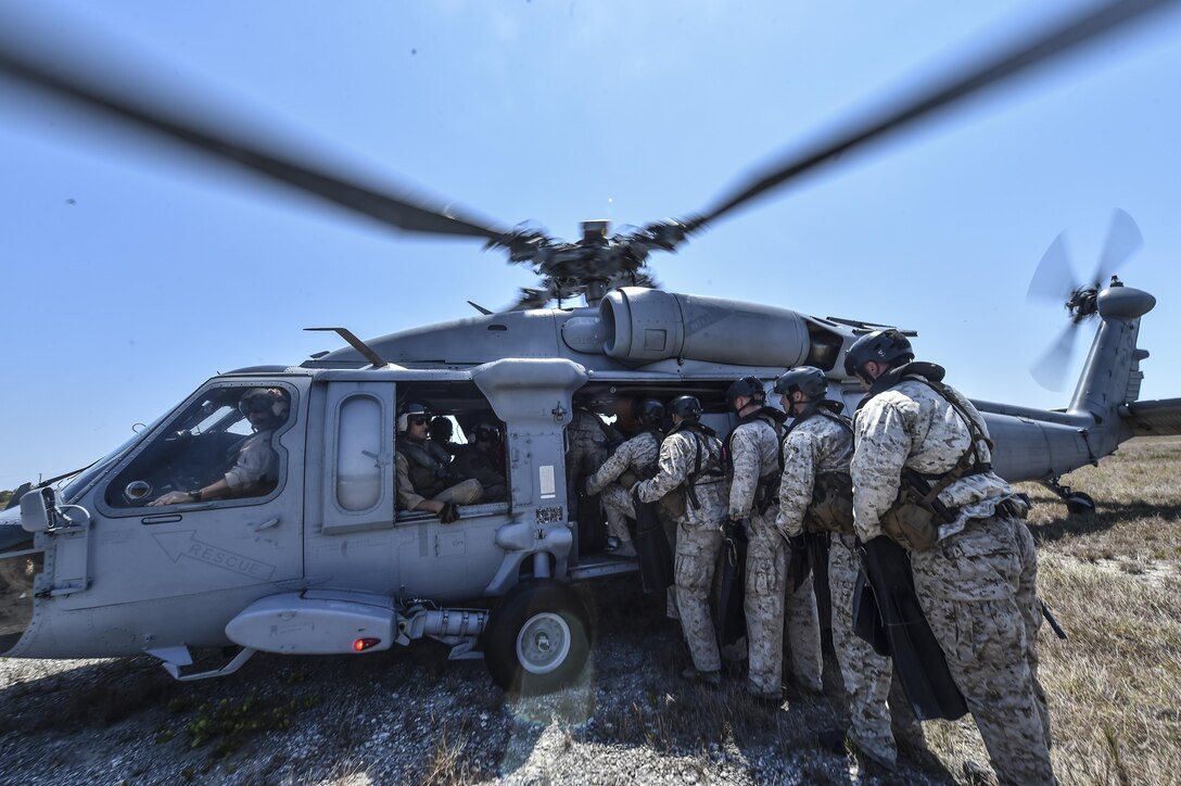 170323-F-BH566-140 -- Marine Special Operations School Individual Training Course students load onto a U.S. Navy SH-60 Seahawk Helicopter for helocasting training, March 23, 2017, at Key West, Fla. For the first time, U.S. Air Force Special Tactics Airmen spent three months in Marine Special Operations Command’s initial Marine Raider training pipeline, representing efforts to build joint mindsets across special operations forces.  (U.S. Air Force photo by Senior Airman Ryan Conroy)