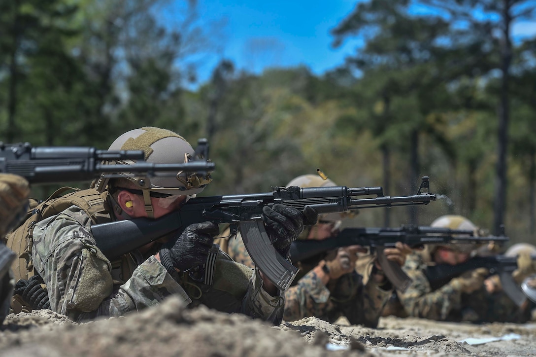 U.S. Marines and Airmen fire Kalashnikov AK-47 assault rifles during a foreign-weapons familiarization class at Marine Special Operations School’s Individual Training Course, April 10, 2017, at Camp Lejeune, N.C. For the first time, U.S. Air Force Special Tactics Airmen spent three months in Marine Special Operations Command’s initial Marine Raider training pipeline, representing efforts to build joint mindsets across special operations forces.  (U.S. Air Force photo by Senior Airman Ryan Conroy)