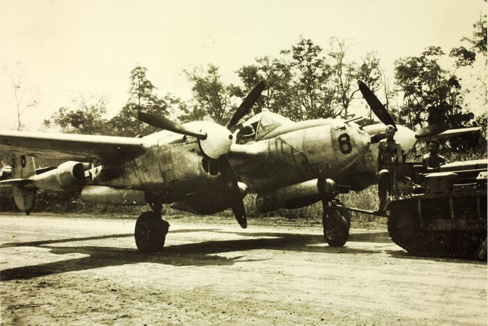 Airmen tow a P-38 Lightning assigned to the 8th Fighter Group, 35th Fighter Squadron, somewhere in the South Pacific during World War II. Courtesy photo