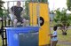 A McChord Field dependent dunks Senior Master Sgt. James Niblock, 627th Logistics Readiness Squadron deployment and distribution flight superintendent, into a dunk tank at the Hearts Apart dinner June 6, 2017, at Joint Base Lewis-McChord, Wash. The informal dinner allowed Airmen to attend in civilian attire with their spouses and children, and participate in a variety of activities. (U.S. Air Force photo/Senior Airman Jacob Jimenez)    