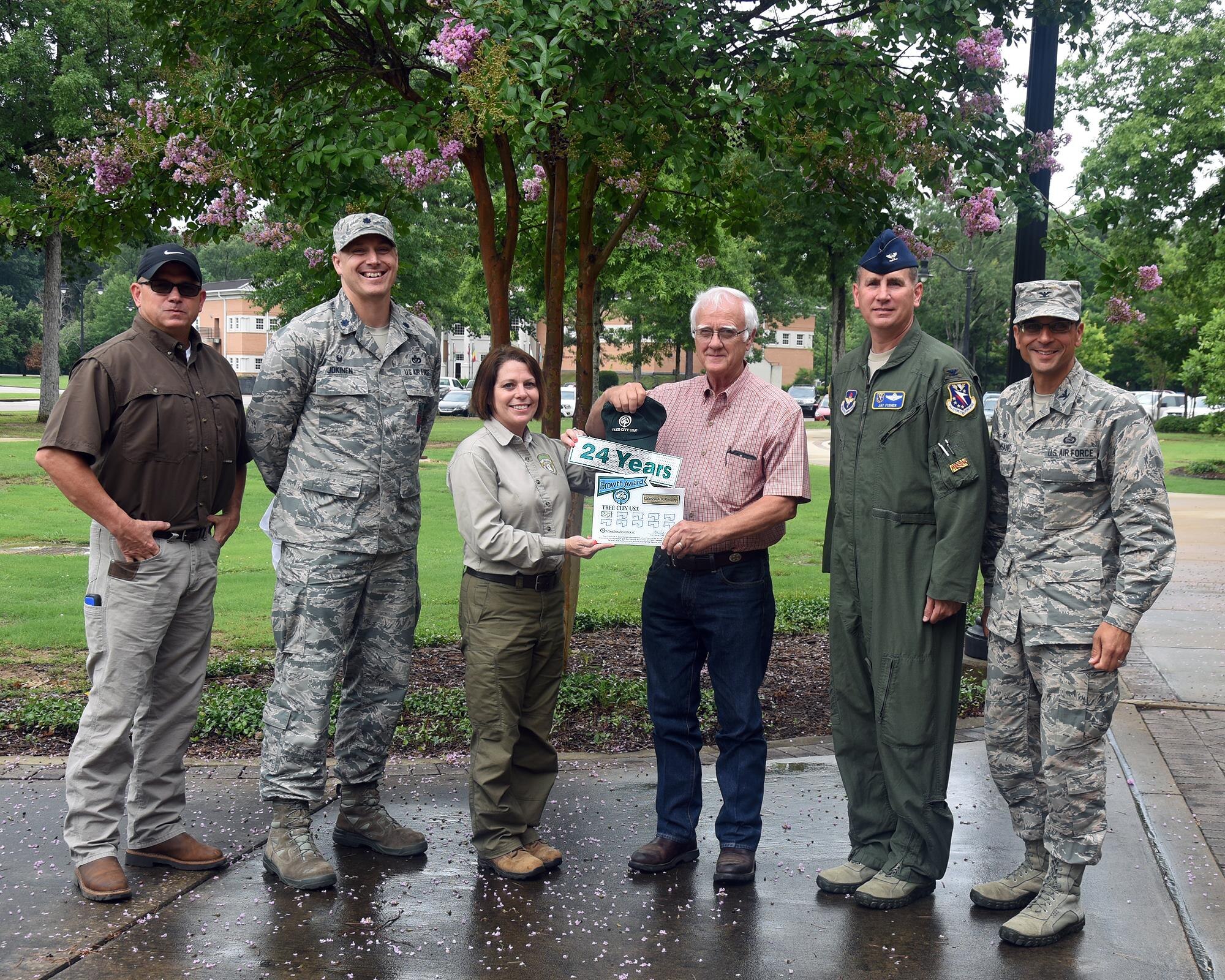 Columbus Air Force Base, Mississippi, is presented with the 24th annual Tree City USA Award and Growth Award June 5, 2017. Columbus AFB is one of only 45 cities in the state qualifying for this award. (U.S. Air Force photo by Sharon Ybarra)