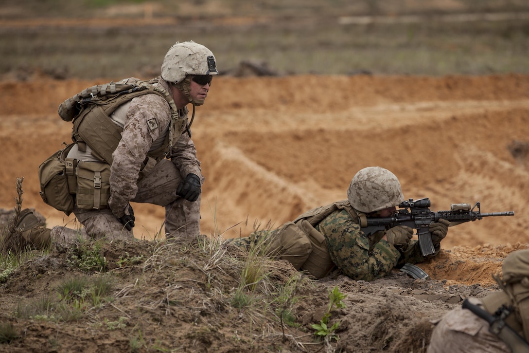 ADAZI, Latvia - Marines with Charlie Company, 4th Light Armored Reconnaissance Battalion, 4th Marine Division, Marine Forces Reserve, conduct live fire movement to contact drills during Exercise Saber Strike 17 in the Adazi Training Area, Latvia, June 5, 2017. Exercise Saber Strike 17 is an annual combined-joint exercise conducted at various locations throughout the Baltic region and Poland. The combined training exercise keeps Reserve Marines ready to respond in times of crisis by providing them with unique training opportunities outside the continental United States. (U.S. Marine Corps photo by Lance Cpl. Ricardo Davila/Released)