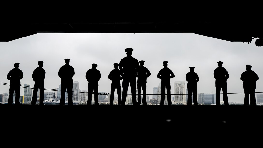 Sailors man the rails aboard the aircraft carrier USS Nimitz in San Diego, June 5, 2017. The Nimitz Carrier Strike Group departed for a regularly scheduled deployment. Navy photo by Petty Officer 2nd Class Holly L. Herline