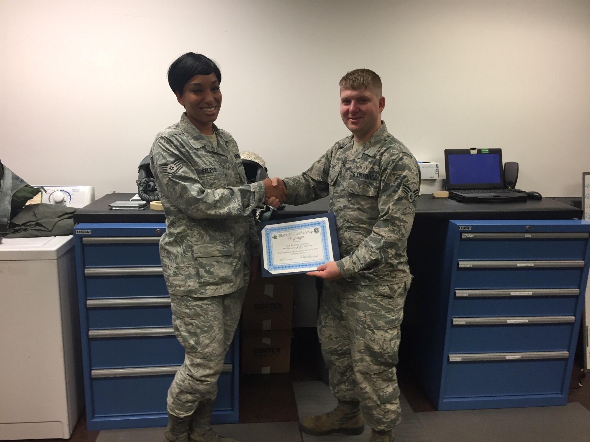 Senior Airman Garrett Jacobs, 14th Operations Support Squadron Aircrew Flight Equipment Apprentice, received the Blaze 5/6 Leadership Highlight award from Staff Sgt. Whitney Felder, Blaze 5/6 Council President June 5, 2017, on Columbus Air Force Base, Mississippi. This award recognized Jacobs’ outstanding leadership capabilities. (U.S. Air Force photo by Sharon Ybarra)