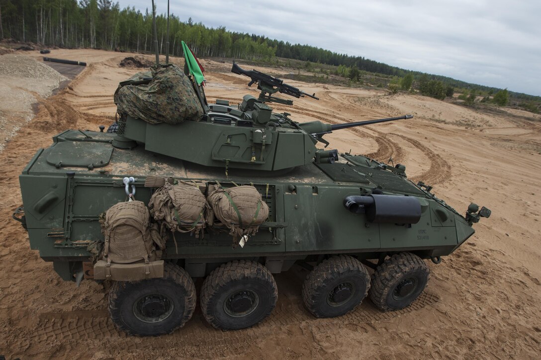 ADAZI, Latvia - Marines with Charlie Company, 4th Light Armored Reconnaissance Battalion, 4th Marine Division, Marine Forces Reserve, conduct the firing of Light Armored Vehicles during Exercise Saber Strike 17 in the Adazi Training Area, Latvia, June 5, 2017. Exercise Saber Strike 17 is an annual combined-joint exercise conducted at various locations throughout the Baltic region and Poland. The combined training exercise keeps Reserve Marines ready to respond in times of crisis by providing them with unique training opportunities outside the continental United States. (U.S. Marine Corps photo by Lance Cpl. Ricardo Davila/Released)