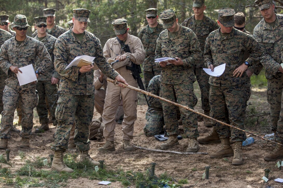ADAZI, Latvia - Marines with the Black Sea Rotational Force 17.1 deliver the live-fire exercise brief to Reserve Marines and forces from the United Kingdom, Slovakia, and Italy, during Exercise Saber Strike 17 in the Adazi Training Area, Latvia, June 6, 2017. Exercise Saber Strike 17 is an annual combined-joint exercise conducted at various locations throughout the Baltic region and Poland. The combined training prepares NATO Allies and partners to effectively respond to regional crises and to meet their own security needs by strengthening their borders and countering threats. (U.S. Marine Corps photo by Lance Cpl. Ricardo Davila/Released)