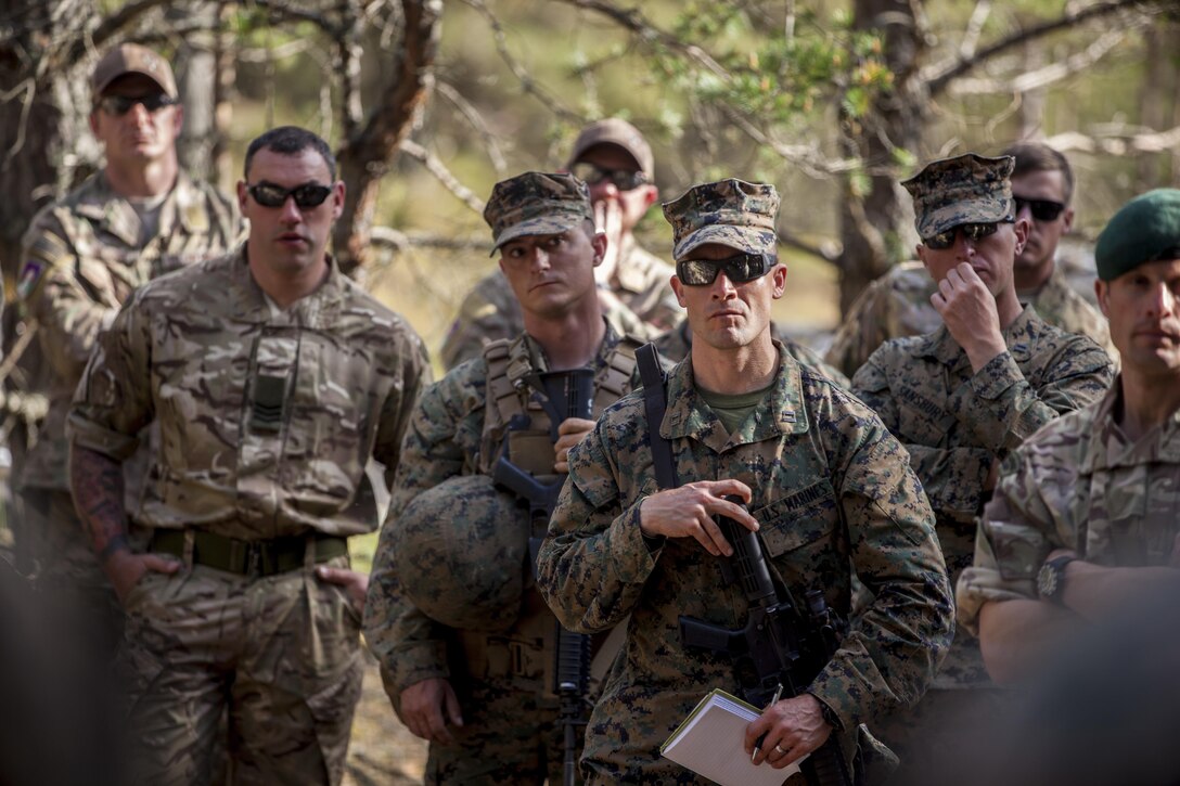 ADAZI, Latvia - Marines with the Black Sea Rotational Force 17.1 deliver the live-fire exercise brief to Reserve Marines and forces from the United Kingdom, Slovakia, and Italy, during Exercise Saber Strike 17 in the Adazi Training Area, Latvia, June 6, 2017. Exercise Saber Strike 17 is an annual combined-joint exercise conducted at various locations throughout the Baltic region and Poland. The combined training prepares NATO Allies and partners to effectively respond to regional crises and to meet their own security needs by strengthening their borders and countering threats. (U.S. Marine Corps photo by Lance Cpl. Ricardo Davila/Released)