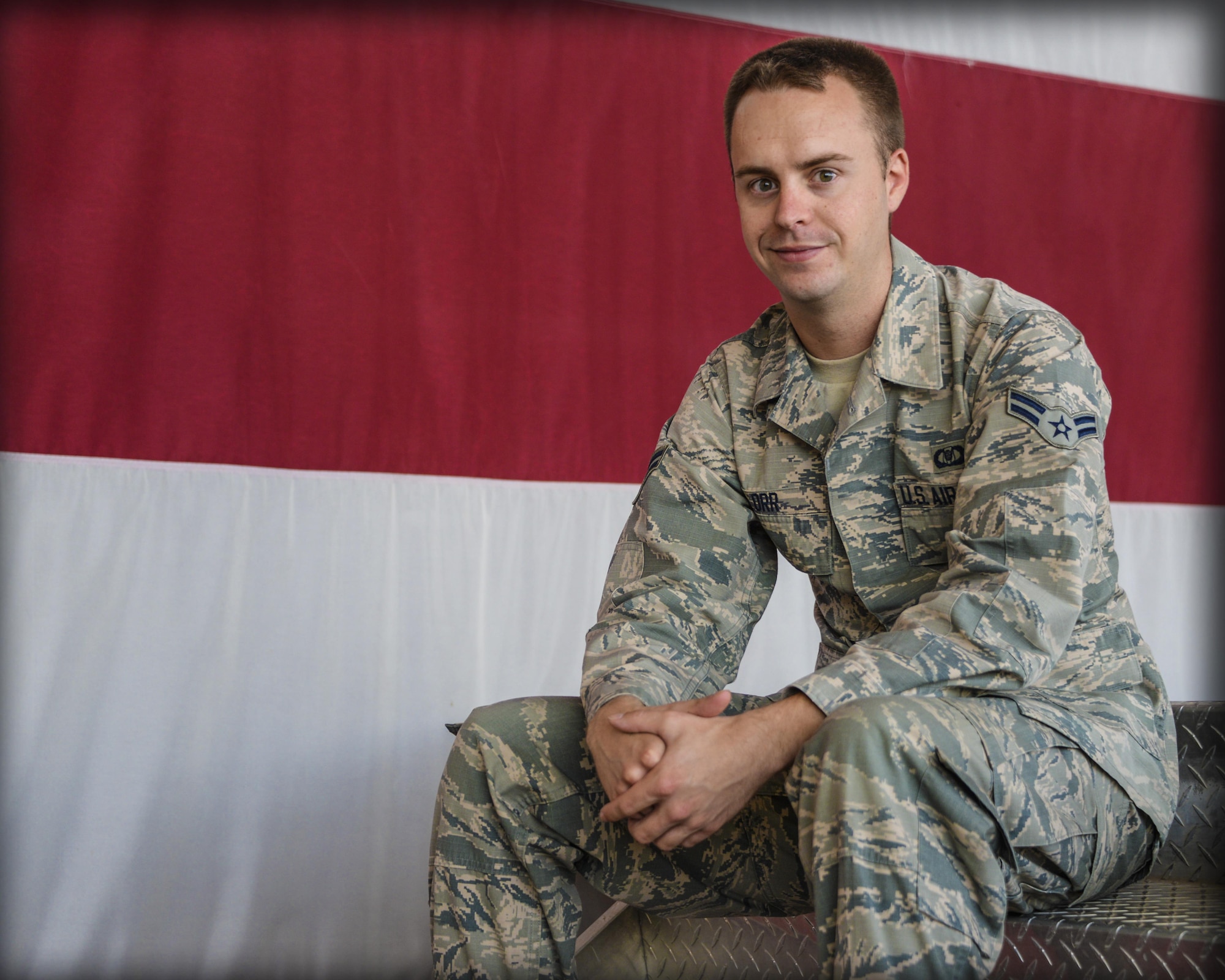 Airman 1st Class Timothy Orr, 944th Operations Group aviation resource manager, poses for a portrait after singing the National Anthem June 8, 2017 at Luke Air Force Base, Ariz. Orr performs the National Anthem approximately seven times a month at various functions both on and off base representing service members stationed at Luke. (U.S. Air Force photo by Airman 1st Class Caleb Worpel)