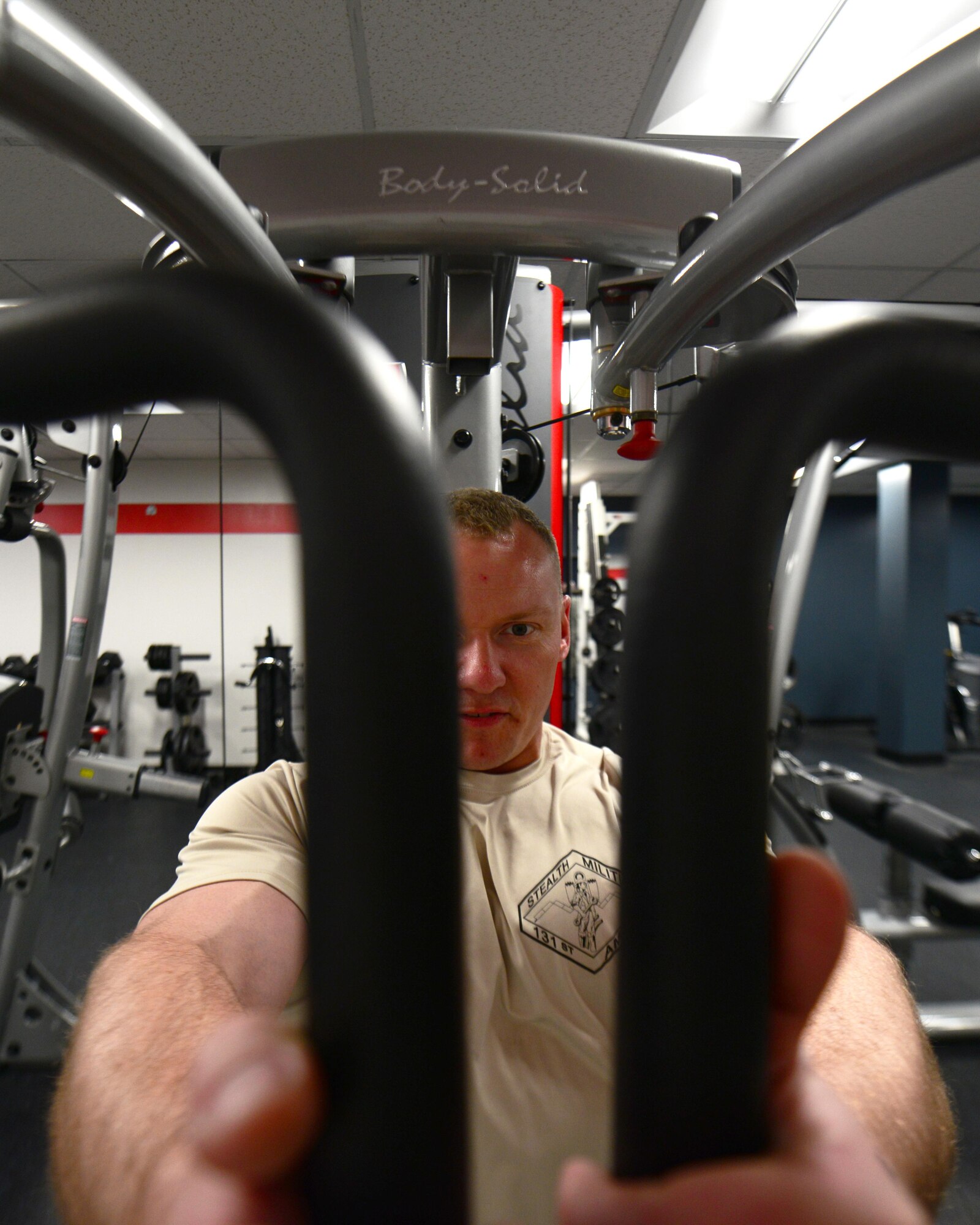 U.S. Air Force Master Sgt. Jonathon Hamilton, a weapons load crew member from the 131st Aircraft Maintenance Squadron, works out at the new flightline gym at Whiteman Air Force Base, Mo., May 30, 2017. The flightline gym was recently renovated to benefit flightline personnel wanting to get a workout in without having to leave the flightline. The renovations were a direct result of the Air Force Global Strike Command’s Year of the Family initiative to improve Airmen workcenters. (U.S. Air Force photo by Senior Airman Joel Pfiester)