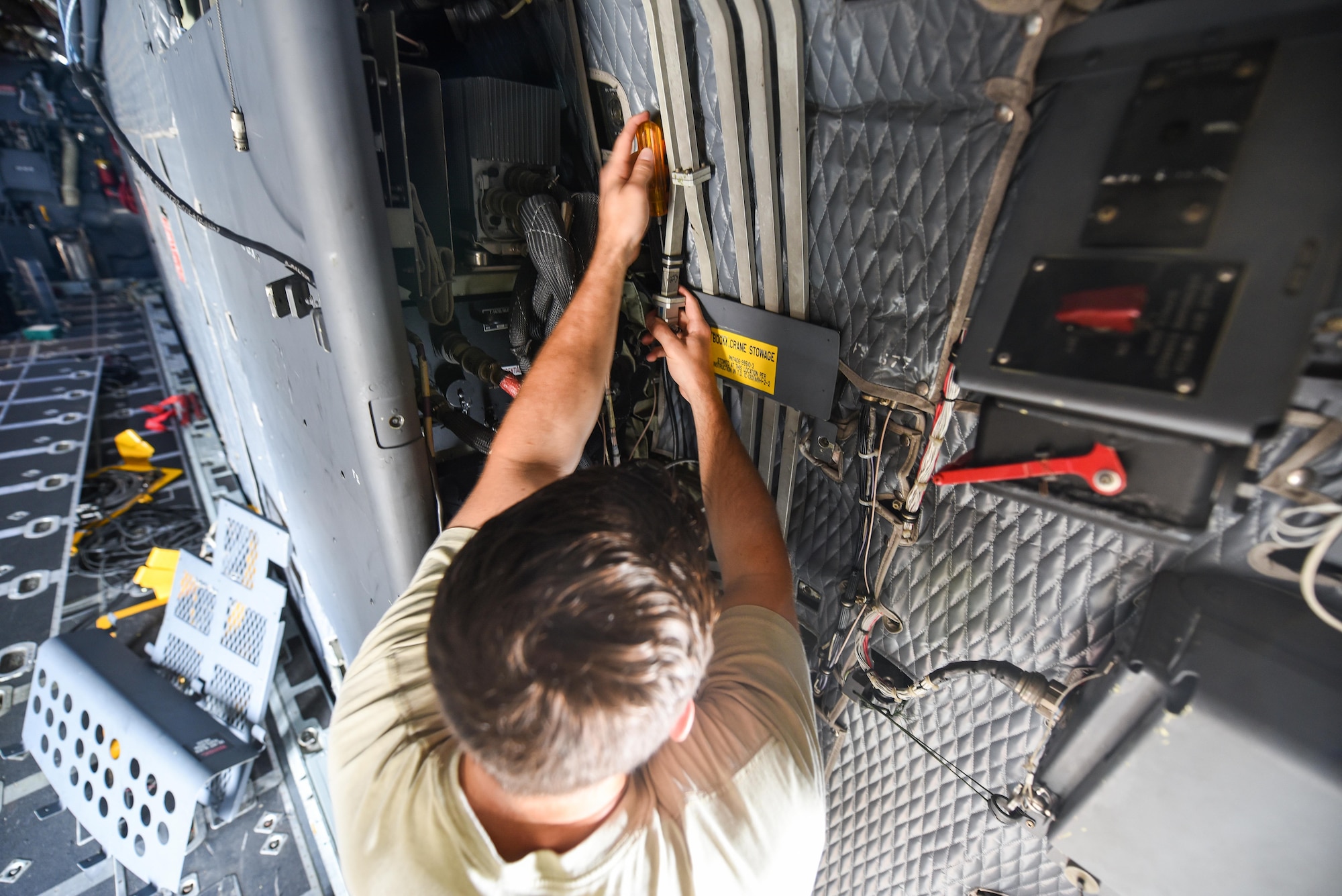 Airman 1st Class Anthony Hause, an electronic warfare journeyman with the 15th Aircraft Maintenance Unit, reassembles a waveguide system on an MC-130H Combat Talon II at Hurlburt Field, Fla., June 7, 2017. Waveguide systems allow the aircraft’s radar jammer to produce the proper signals to effectively prevent aircraft detection while in flight. (U.S. Air Force photo by Staff Sgt. Jeff Parkinson)