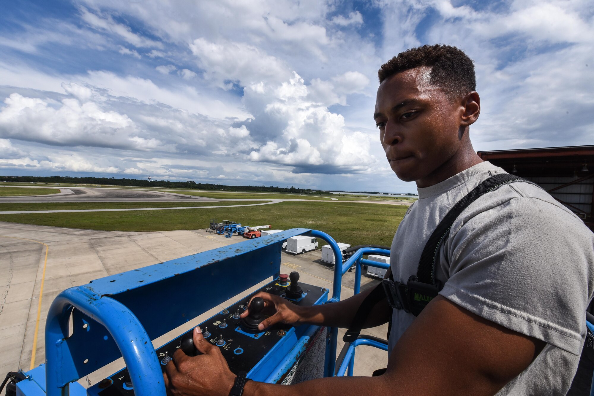 Airman 1st Class William Green, an electronic warfare specialist with the 15th Aircraft Maintenance Unit, operates a lift at Hurlburt Field, Fla., June 7, 2017. The lift allows Green to reach an antenna on the tip of an MC-130H Combat Talon II’s tail during maintenance. (U.S. Air Force photo by Staff Sgt. Jeff Parkinson)