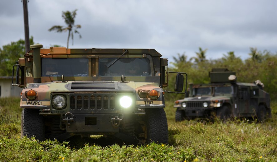 U.S. Soldiers assigned to Task Force Talon (TFT), 94th Army Air and Missile Defense Command, provide security during a combat search and rescue training exercise at Andersen South, Guam, June 5, 2017. Service members from TFT, Helicopter Sea Combat Squadron Two-Five (HSC-25), and the 36th Wing joined together to practice survival, evasion, resistance and escape procedures, emergency evacuation techniques and quick reaction force training. This is the first time these units participated in a combat search and rescue exercise together on Guam. (U.S. Air Force photo by Staff Sgt./Joshua Smoot)
