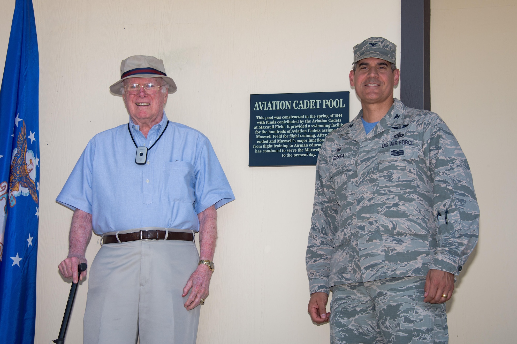 Col. Eric Shafa, 42nd Air Base Wing Commander, and reitred Col. William Quinn, former aviation cadet at Maxwell Air Force Base, Ala., renames the Maxwell Community Pool as the Aviation Cadet Pool, June 9, 2017. The pool was constructed in  1944 with funds contributed by the Aviation Cadets at Maxwell Field. It provided a swimming facility for the hundreds of Aviation Cadets assigned to Maxwell Field for flight training.  (US Air Force photo by Melanie Rodgers Cox)
