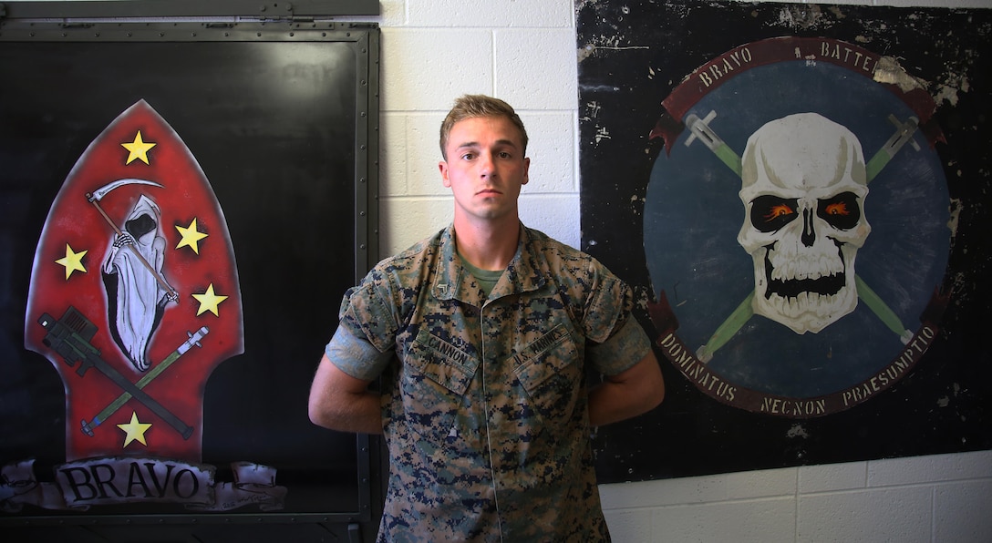 Cpl. Blake Cannon stands proudly in front of B Battery unit logos at Marine Corps Air Station Cherry Point, N.C., June 9, 2017. Cannon is a team leader assigned to 1st platoon of B Battery, 2nd Low Altitude Air Defense Battallion, Marine Air Control Group 28, and takes on the responsibilty of training the Marines in his team to the highest standards. (U.S. Marine Corps photo by Pfc. Skyler Pumphret/ Released)