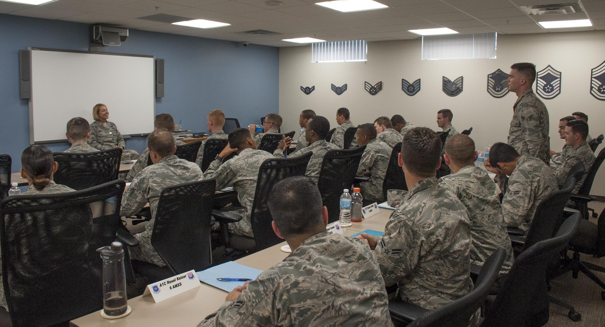 Chief Master Sgt. Melanie K. Noel, left, Command Chief assigned to the 6th Air Mobility Wing, talks to First Term Airmen Course Airmen at MacDill Air Force Base Fla., June 9, 2017. The FTAC Airmen were the first MacDill Airmen to graduate the new course known as Airmanship 300. (U.S. Air Force photo by Airman 1st Class Mariette Adams)