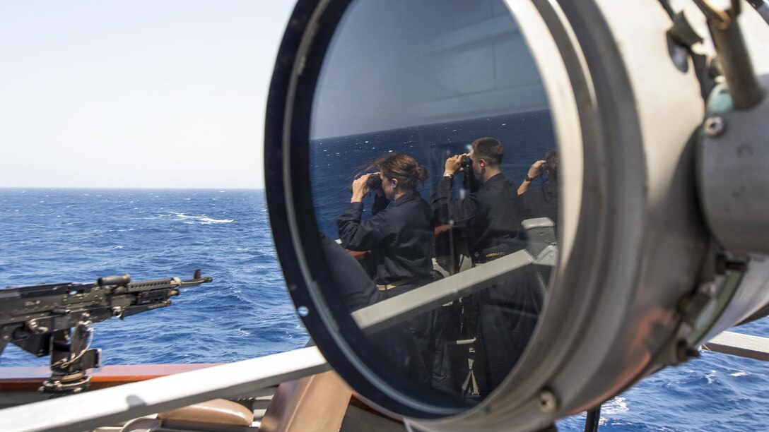 Naval Academy midshipmen aboard the USS Carney look for surface contacts before a live-fire gunnery exercise in the Mediterranean Sea, June 8, 2017. The Carney is on patrol in the U.S. 6th Fleet area of responsibility supporting U.S. national security interests in Europe. Navy photo by Petty Officer 3rd Class Weston Jones