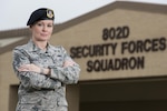 Tech Sgt. Michelle Aberle, 802nd Security Forces Squadron installation security, poses for a photo after conducting a security check on the base fence line May 9, 2017, at Joint Base San Antonio-Lackland, Texas. Aberle and Tech. Sgt. Paul Turner, also 802 SFS instalation securityprovide force protection for base personnel, equipment and facilities from threats to include intrusions by unauthorized people. (U.S. Air Force photo by Sean Worrell)