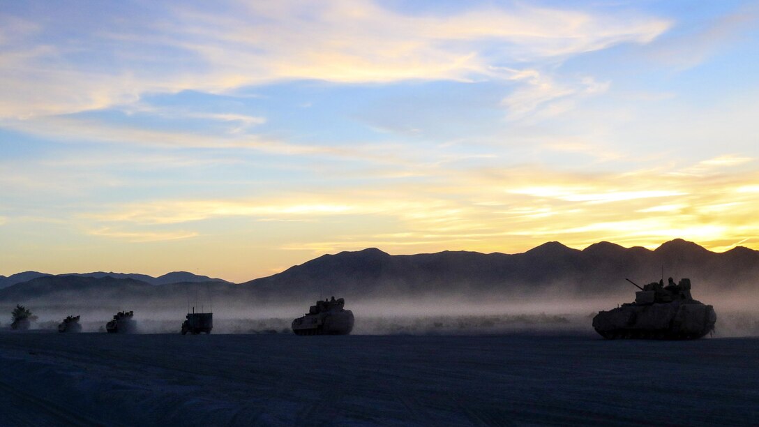 Bradley Fighting Vehicles and Humvees drive to the dry-fire exercise area at the National Training Center at Fort Irwin, Calif., June 7, 2017. The vehicles are assigned to the 1st Squadron, 98th Cavalry Regiment, Mississippi Army National Guard. Mississippi National Guard photo by Pfc. Jarvis Mace