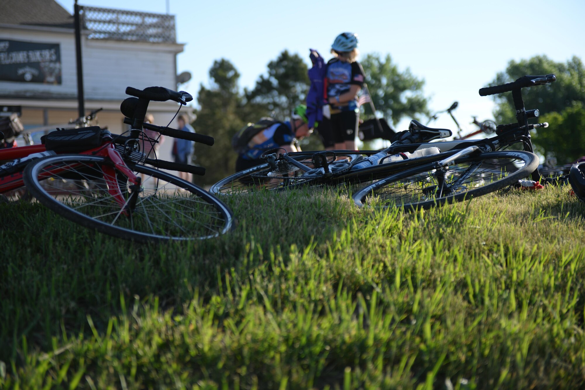 Riders take a break from the Ride Across South Dakota bike tour in Caputa, S.D., June 4, 2017. The RASDAK entails 516 miles, but the first day encompasses a gradual elevation change of 2000 miles in 74 miles starting from Rapid City to the Badlands National Park. (U.S. Air Force photo by Airman Nicolas Z. Erwin)
