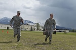 Tech. Sgt. Joshua Hefley, 673d Security Forces Squadron Falcon Flight sergeant carries two loaded ammunition cans through a cone course May 25,2017, at the Elmendorf Fitness Center while Senior Master Sgt. Eric Hall, 673d SFS integrated defense superintendent times him. The ammunition run is a part of the 2017 Pacific Air Forces Advanced Combat Skills Assessment they are competing in. 