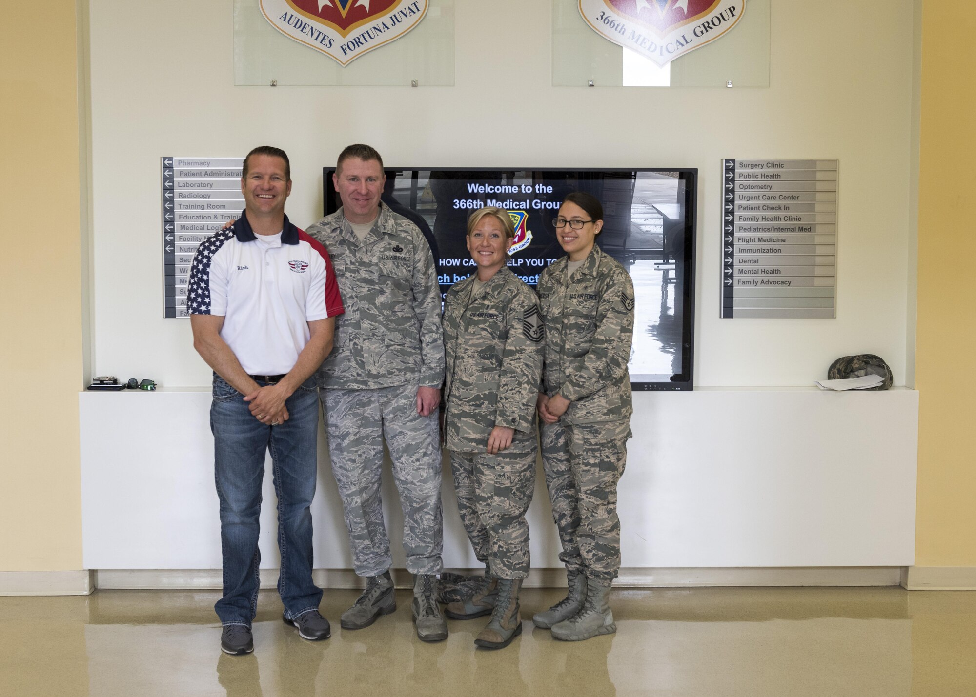 Rich Sykes, Mountain Home mayor, poses for a photo with Chief Master Sgt. Chad Bickley, 366th Fighter Wing command chief, and other medical airmen, June 1, 2017, at Mountain Home Air Force Base, Idaho. Before Sykes' orientation flight he had to have a flight physical to determine if he way cleared to fly.(U.S. Air Force Photo by Senior Airman Jeremy L. Mosier)